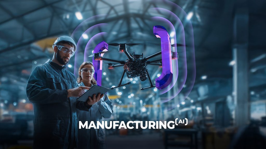 Two engineers in a factory inspect data on a clipboard while a drone with glowing purple sensors hovers above them. The word "MANUFACTURING(AI)" is displayed at the bottom.