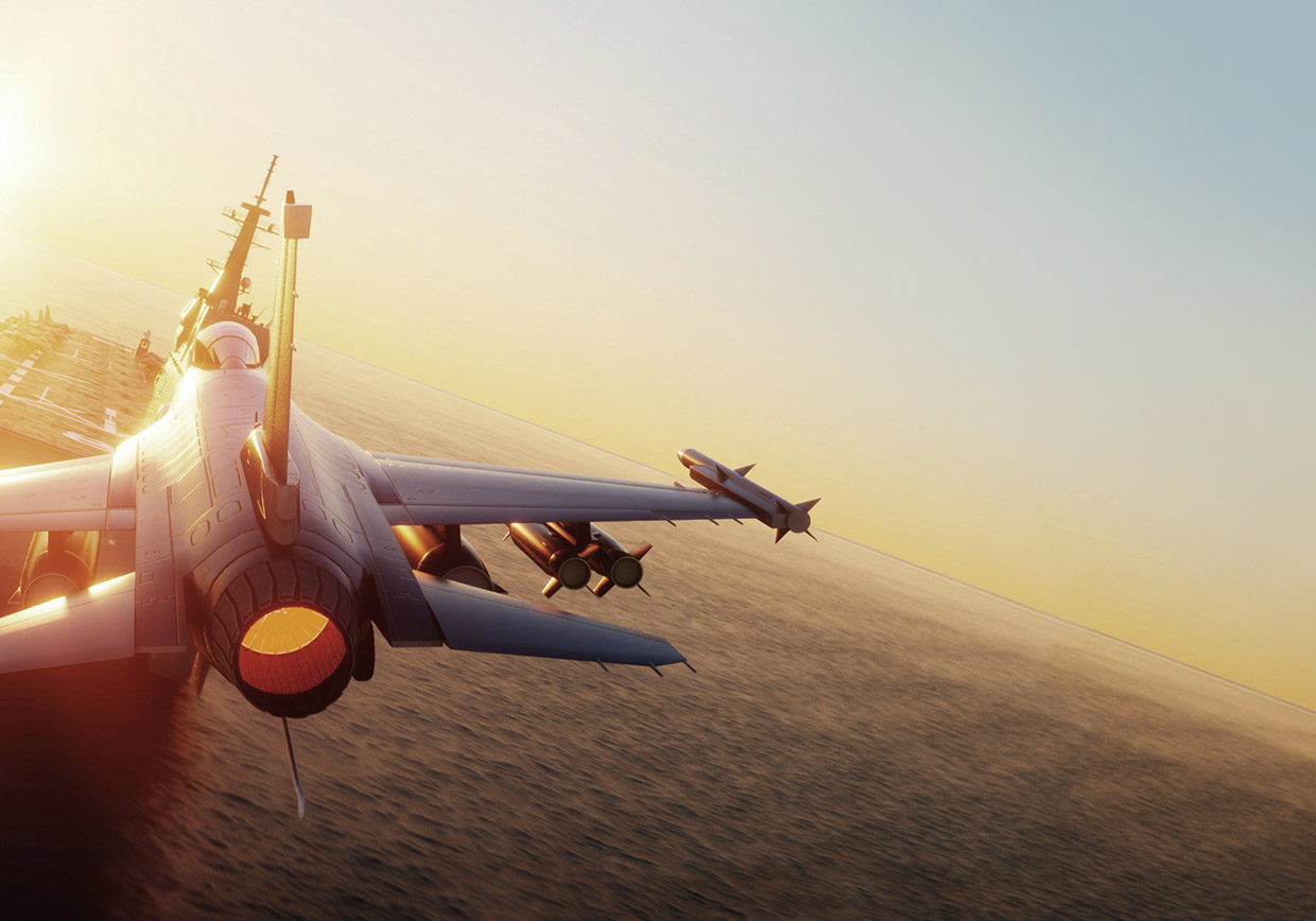 A fighter jet takes off from an aircraft carrier over the ocean at sunset, with the afterburner glowing and another jet flying ahead in the sky.