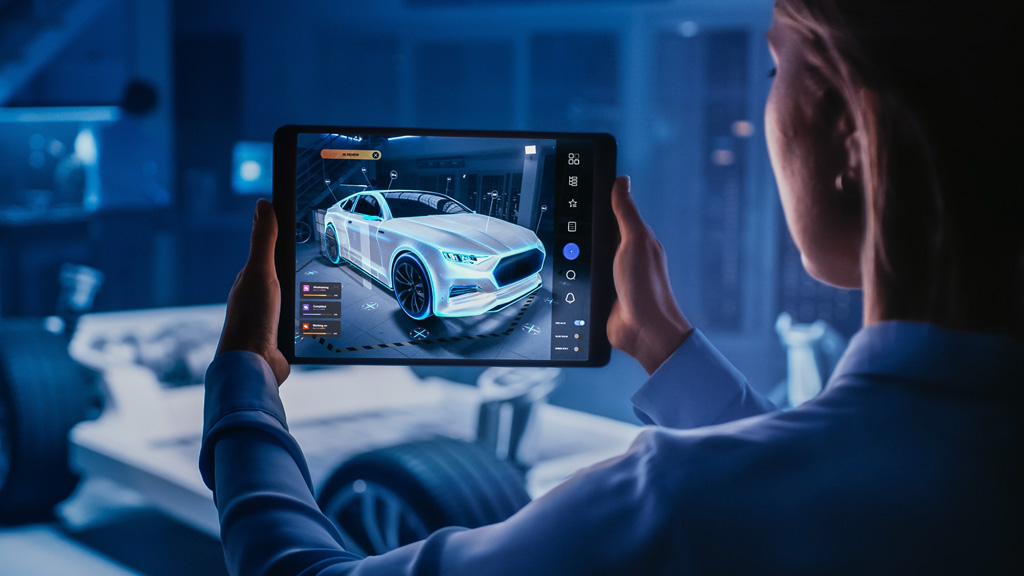 man looking at car on a tablet