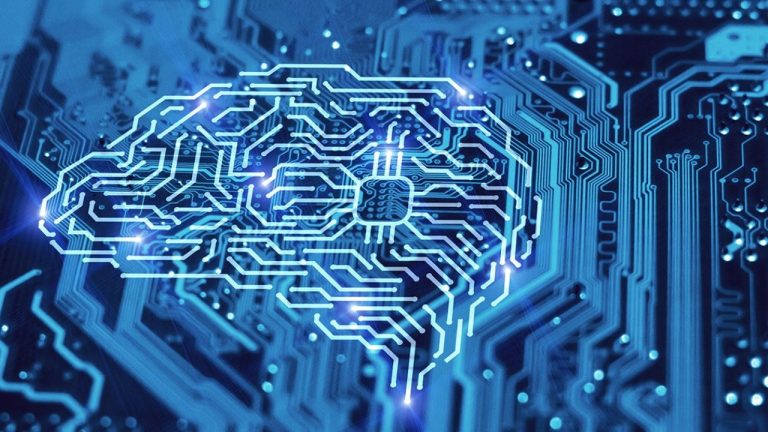 A glowing blue circuit board in the shape of a human brain, symbolizing artificial intelligence and technology integration. The intricate pathways highlight the interconnected nature of neural networks and electronic systems.