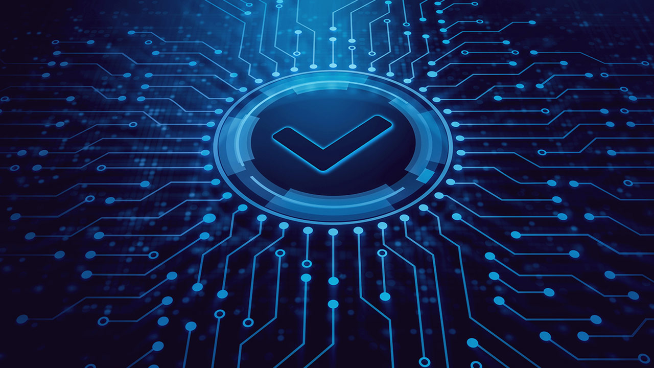 A glowing check mark inside a circular frame is centered on a blue digital circuit board background, symbolizing cybersecurity, digital validation, or system approval.