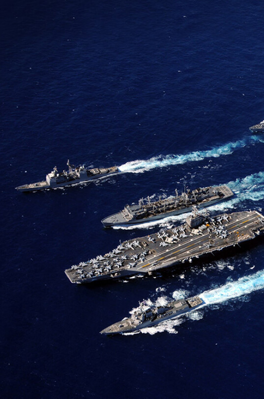 Four warships sailing.