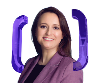 Smiling woman with straight brown hair wears a mauve blazer and black top, standing in front of a white background with large, purple bracket symbols around her.
