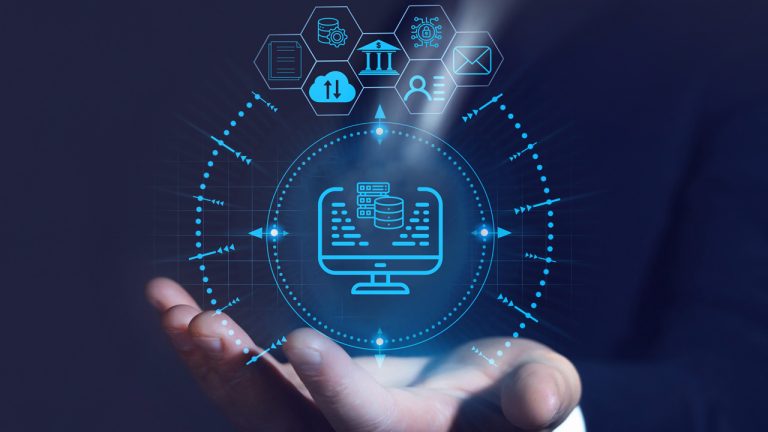 A person's hand is extended with digital holograms displaying various symbols related to technology, such as a computer monitor, cloud storage, gears, and security icons. The background is dark, emphasizing the glowing, futuristic graphics.