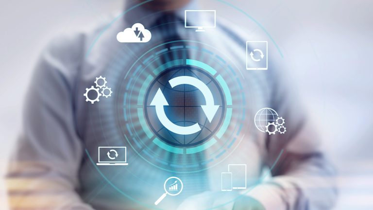 A person in a business suit interacts with futuristic digital icons and a prominent refresh symbol, representing advanced technology or software development concepts.