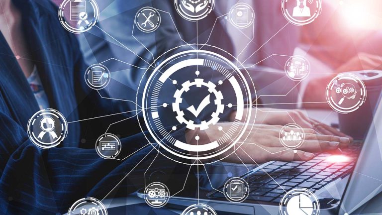 A professional person sits at a laptop with futuristic digital icons and graphics overlaying the image, symbolizing advanced technology and data connectivity in business.