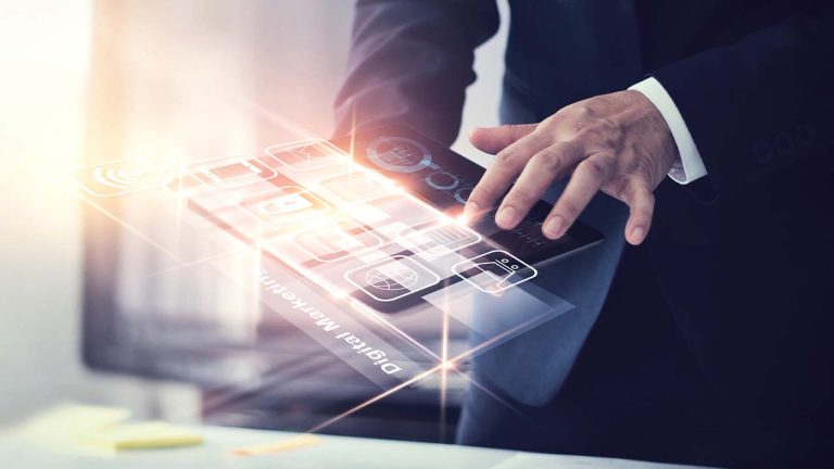 A business professional interacts with a futuristic holographic interface, displaying various digital icons related to finance and communication, emphasizing technology in business.