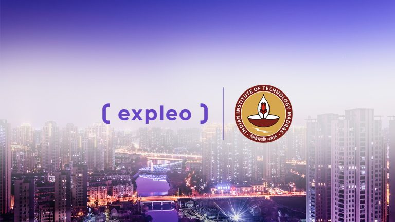 A city skyline with tall buildings at dusk, featuring the Expleo logo and the Indian Institute of Technology Madras emblem in the center on a purple gradient background.
