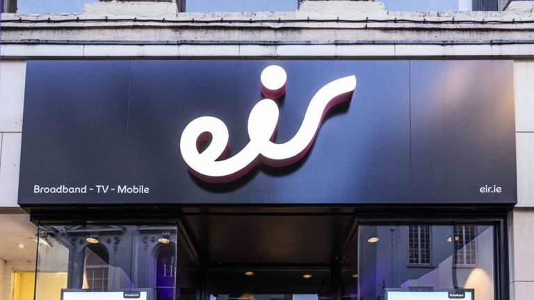 A shopfront sign with the large white logo “eir” on a black background, with “Broadband - TV - Mobile” written in small text on the left and “eir.ie” on the right.