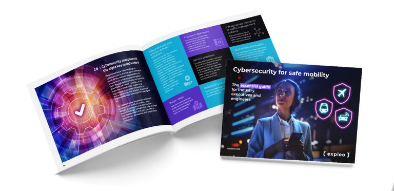 Image of an open book and a brochure. The open book has colorful geometric designs and text on cybersecurity. The brochure cover features a person in a suit holding a phone, with icons representing cybersecurity threats. Title reads, "Cybersecurity for safe mobility.